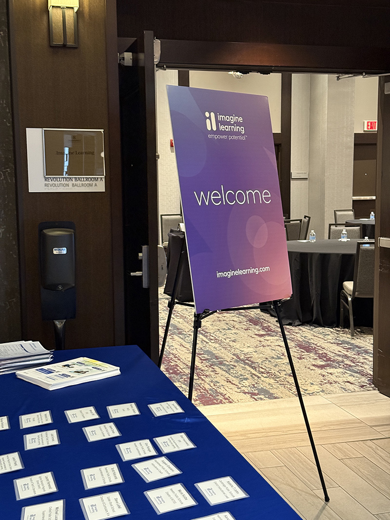 Welcome sign outside a conference room.